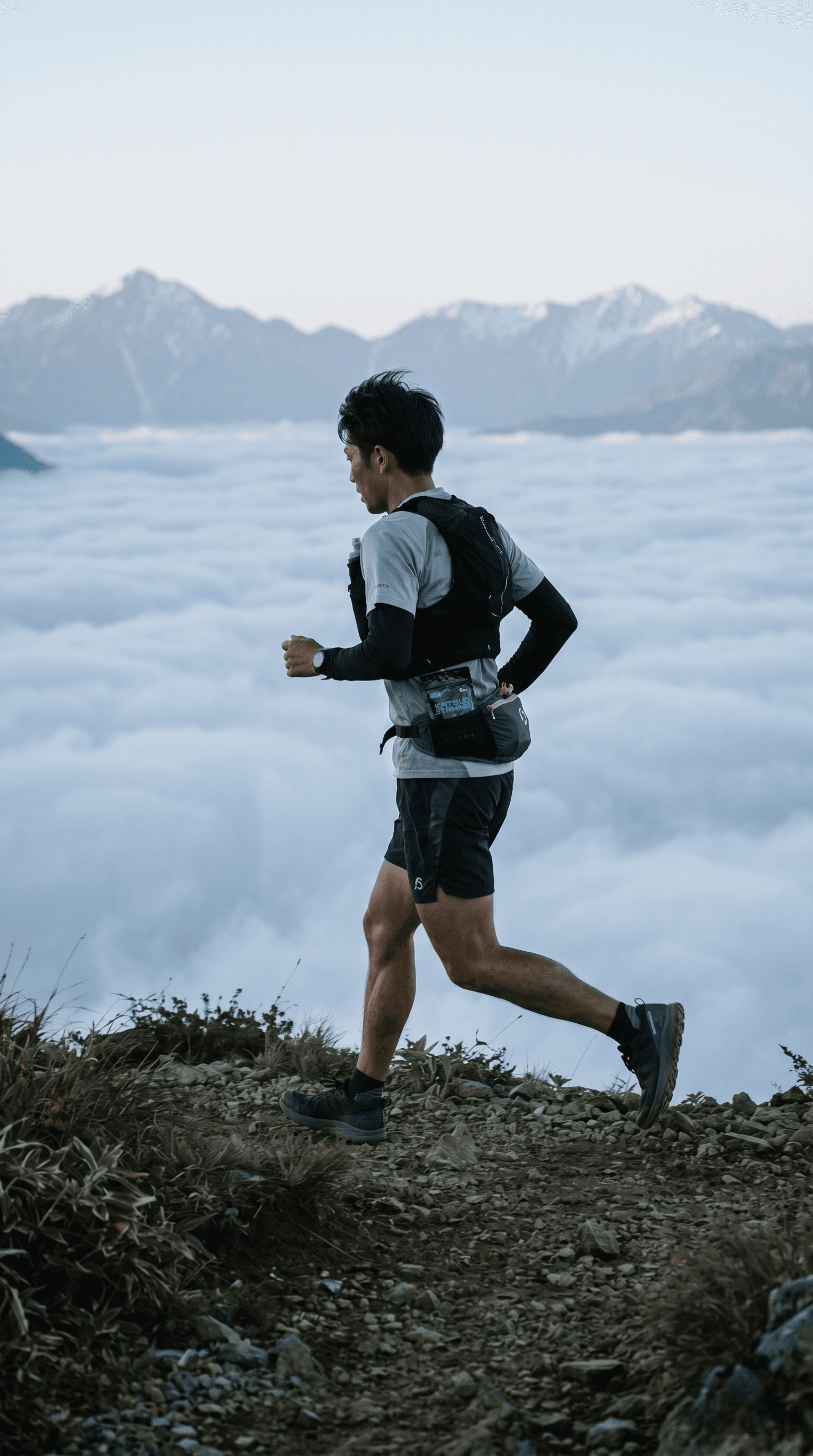 Runner cresting a high ridge